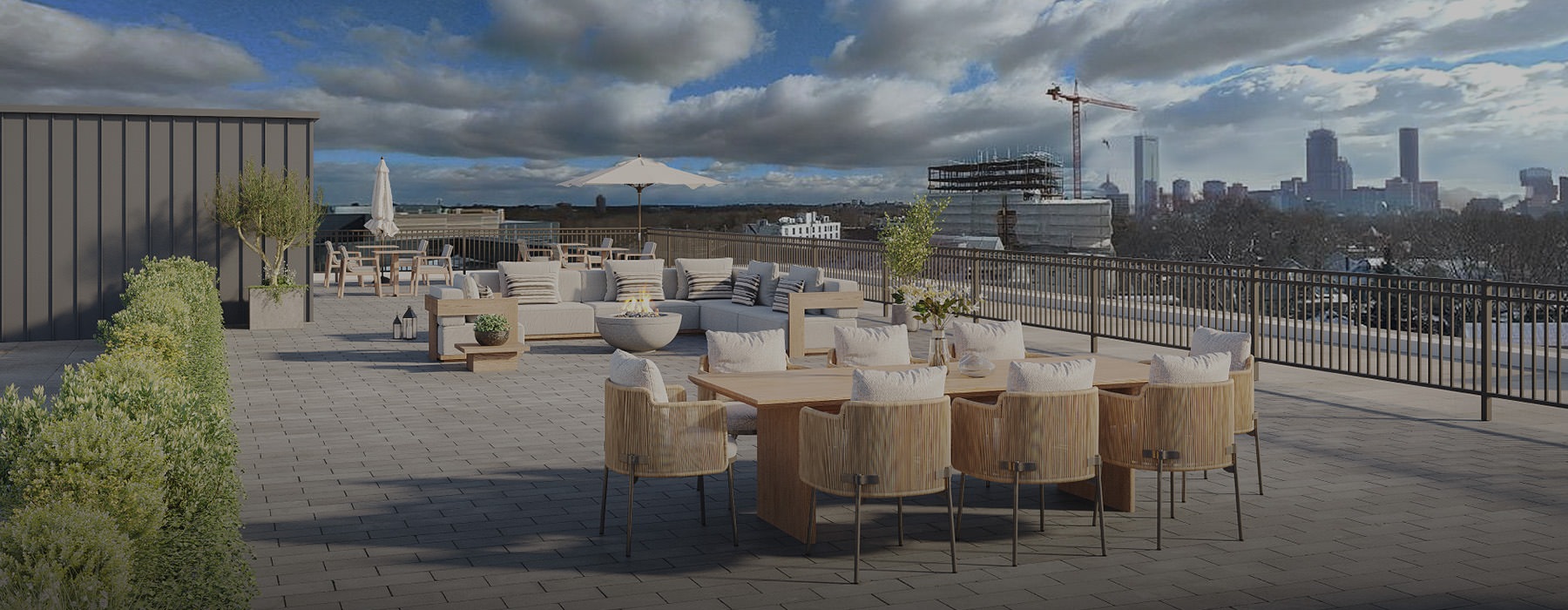 rooftop patio with seating and a view of a city